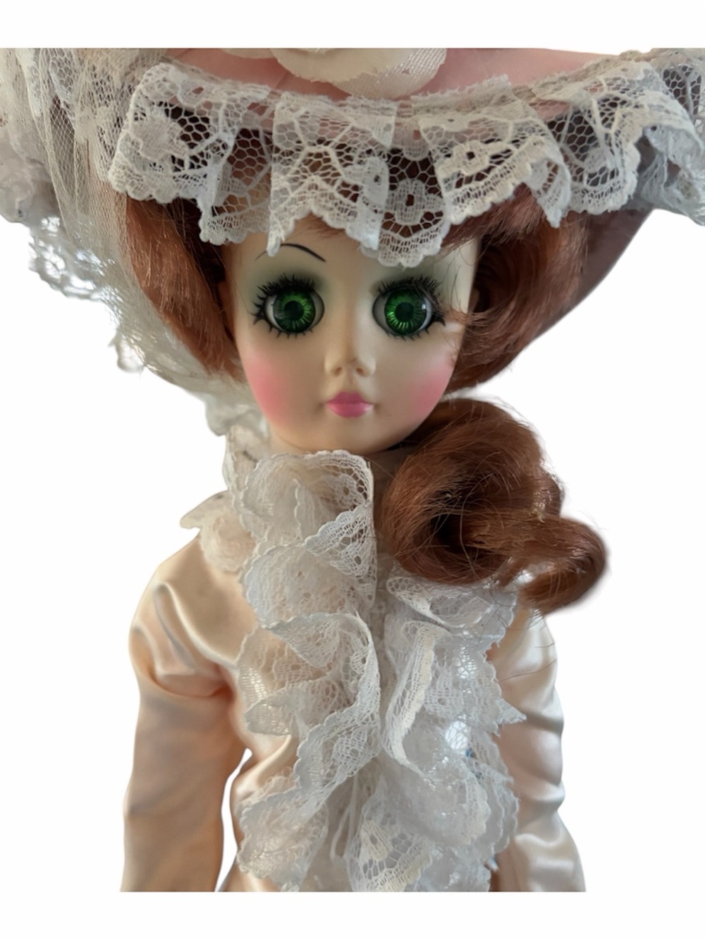 Vintage Porcelain Doll with Green Eyes and Lace Outfit